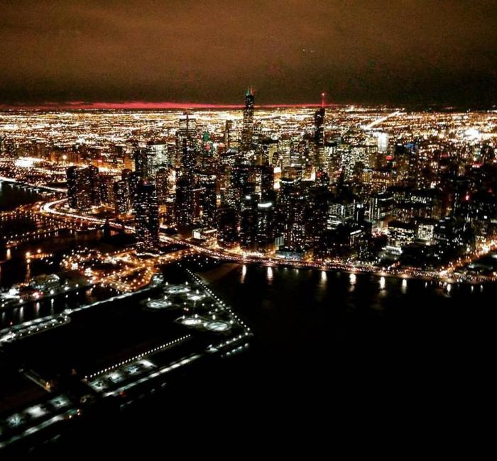 Chicago Helicopter Experience tour of downtown Chicago at night, with beautiful views of the skyline. This one of the most perfect places to propose in Chicago.
