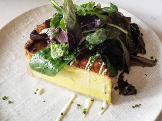 Quiche Lorraine from the brunch menu at Le Sud in Chicago's Roscoe Village
