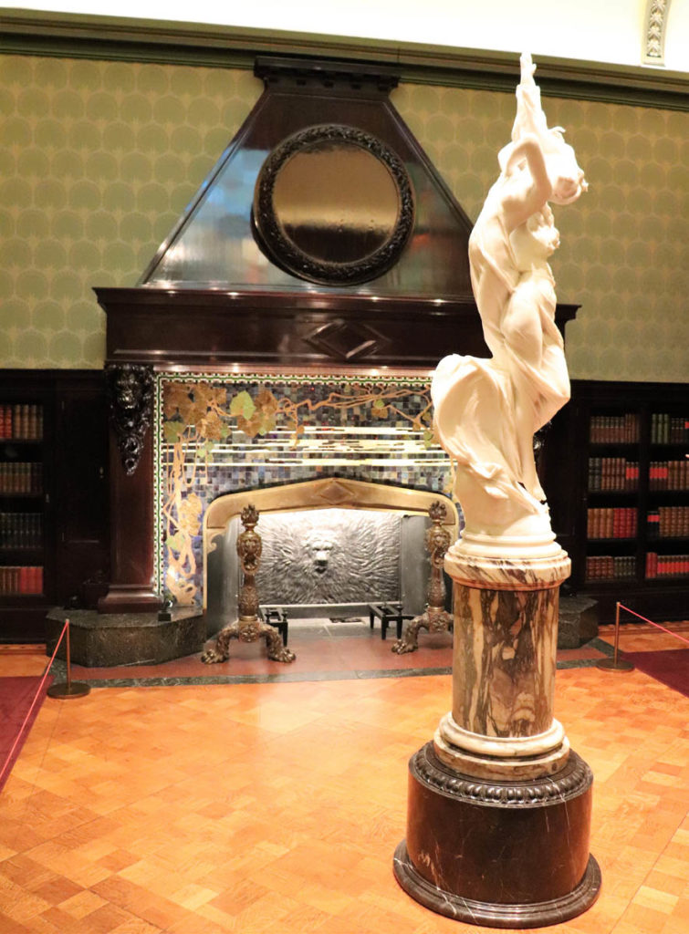 monumental fireplace with an iridescent tile surround