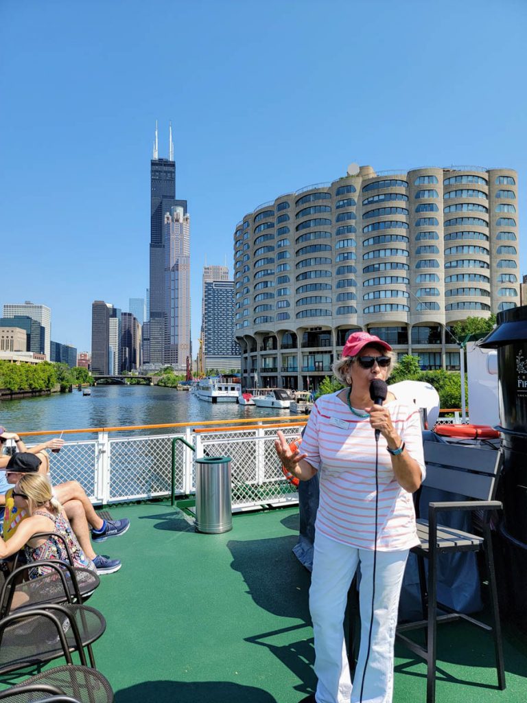 A Chicago Architecture Center docent leading a tour on the Chicago River