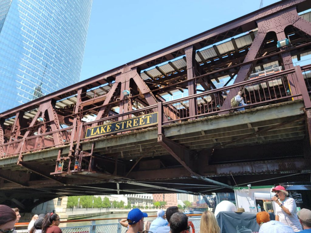 The Chicago Architecture Foundation Center River Cruise passes under Lake Street Bridge 